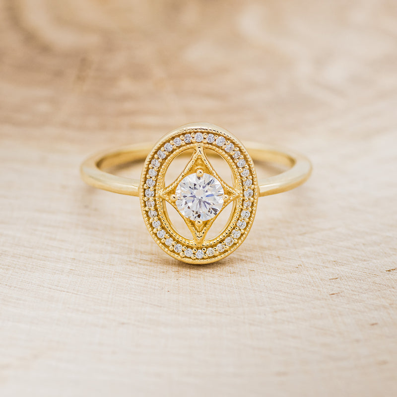 Shown here is "Levina", a diamond women's engagement ring with a diamond halo, front facing. Many other center stone options are available upon request.