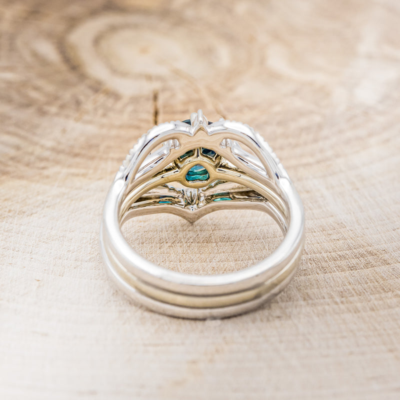 Shown here is Claddagh bridal suite, a solitaire-style lab-created alexandrite women's engagement ring with a diamond accent tracer and a Claddagh tracer, back view. Many other center stone options are available upon request.