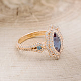 "ADELE" - MARQUISE LAB-GROWN ALEXANDRITE ENGAGEMENT RING WITH ALEXANDRITE ACCENTS, DIAMOND HALO & TRACER
