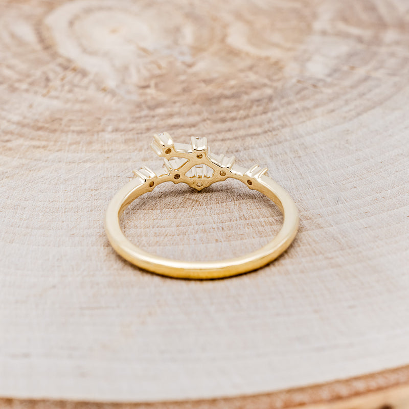 Shown here is "Zodiac", a custom, handcrafted women's stacker featuring a Cancer constellation on a 14K gold band, back view. People born between the dates of June 21st – July 22nd are a Cancer.