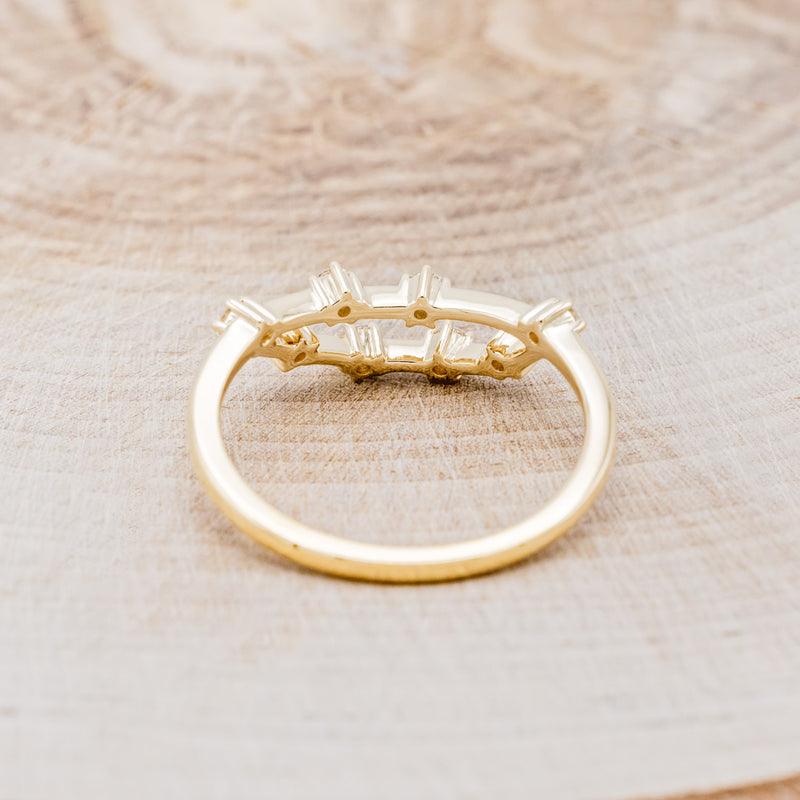 Shown here is "Zodiac", a custom, handcrafted women's stacker featuring a Capricorn constellation on a 14K gold band, back view. People born between the dates of December 22nd – January 19th are a Capricorn.