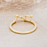 Shown here is "Zodiac", a custom, handcrafted women's stacker featuring a Leo constellation on a 14K gold band, back view. People born between the dates of July 23rd – August 22nd are a Leo.