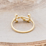 Shown here is "Zodiac", a custom, handcrafted women's stacker featuring a Scorpio constellation on a 14K gold band, back view. People born between the dates of October 23rd – November 21st are a Scorpio.