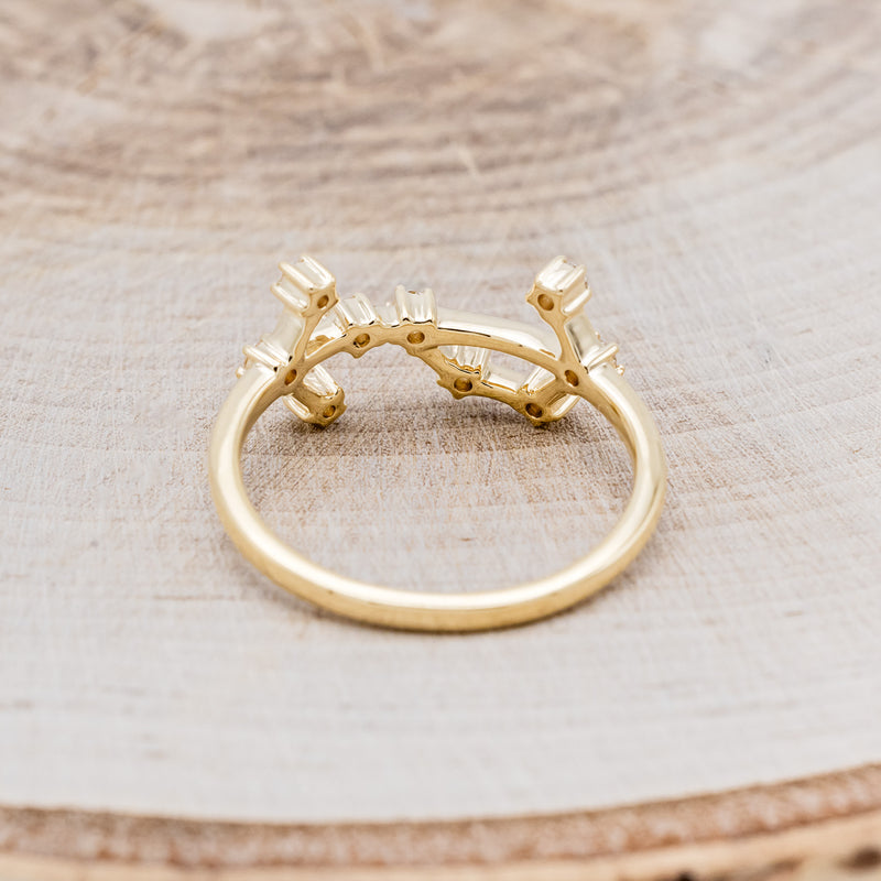 Shown here is "Zodiac", a custom, handcrafted women's stacker featuring a Scorpio constellation on a 14K gold band, back view. People born between the dates of October 23rd – November 21st are a Scorpio.