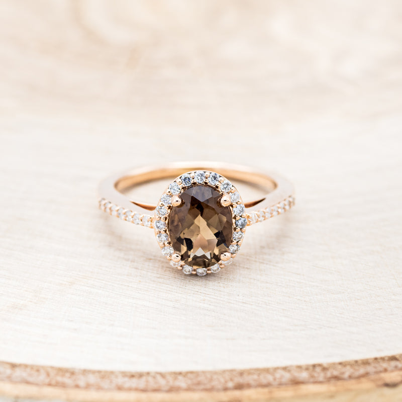 Shown here is "Diana", an oval smoky quartz women's engagement ring with a diamond halo and diamond accents, front facing. Many other center stone options are available upon request.