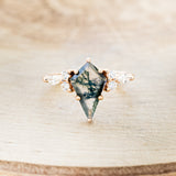 Shown here is "Sage", a moss agate women's engagement ring with diamond accents, front facing. Many other center stone options are available upon request.