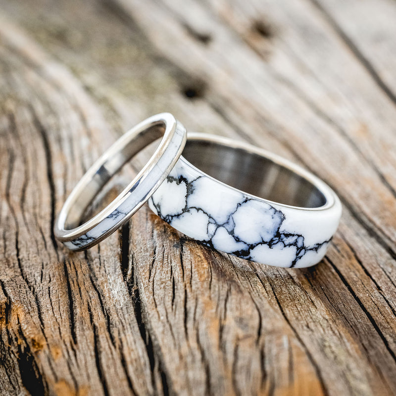 Shown here is "Haven" & "Eterna", custom, handcrafted matching set of wedding rings featuring white turquoise TruStone overlay on titanium bands, laying together. Additional inlay options are available upon request.