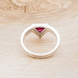 Shown here is "Jenny From The Block", a dainty-style triangle lab-created ruby women's engagement ring with a v-shaped diamond tracer, back view. Many other center stone options are available upon request.