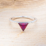 Shown here is "Jenny From The Block", a dainty-style triangle lab-created ruby women's engagement ring, front facing. Many other center stone options are available upon request.
