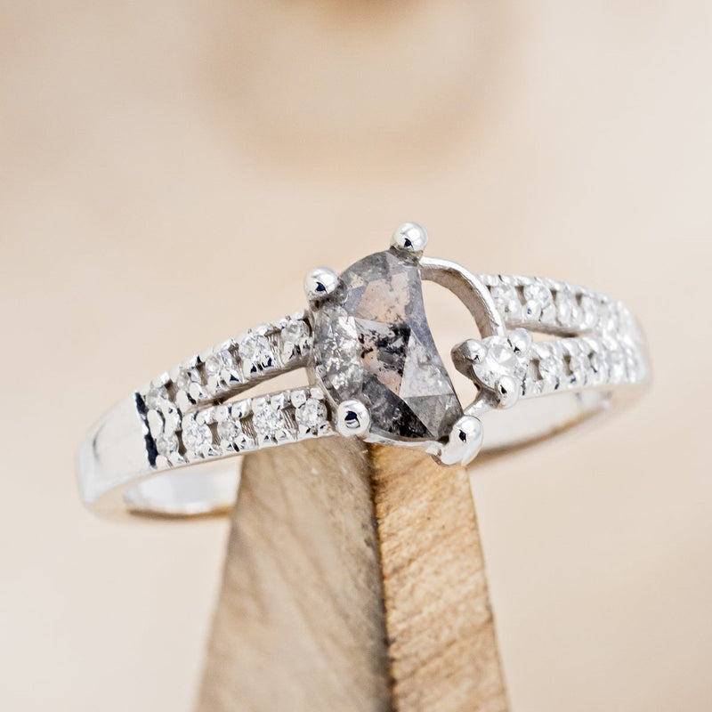 Shown here is "Nyx", a crescent moon salt & pepper diamond women's engagement ring with a single diamond accent and a diamond accented band, on stand front facing. Many other center stone option are available upon request. 