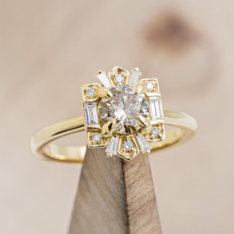 Shown here is "Cleopatra", an art deco-style champagne diamond women's engagement ring with diamond accents, on stand front facing. Many other center stone options are available upon request.