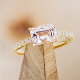 Shown here is the "Amara" ring. It is a pavé-style Morganite women's engagement ring with diamond accents.