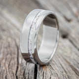Shown here is "Vertigo", a custom, handcrafted men's wedding ring featuring an elk antler inlay, upright facing left. Additional inlay options are available upon request.