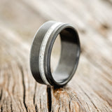 Shown here is "Vertigo", a custom, handcrafted men's wedding ring featuring an antler inlay with a sandblasted finish, upright facing left. Additional inlay options are available upon request.