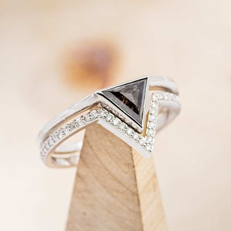 Shown here is "Jenny From The Block", a dainty-style triangle salt and pepper diamond women's engagement ring with a v-shaped diamond tracer, on stand facing slightly right. Many other center stone options available upon request.