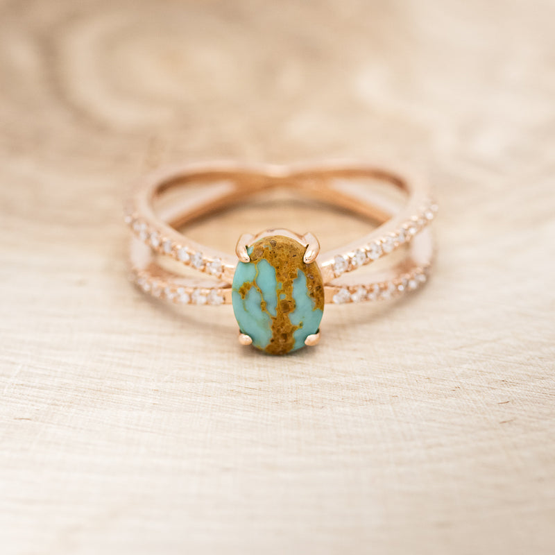 Shown here is "Anastasia", a split shank-style turquoise women's engagement ring with diamond accents, front facing.