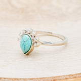 Shown here is "Shania", a turquoise women's engagement ring with diamond accents, facing left. Many other center stone options are available upon request.