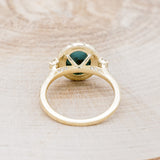 Shown here is "KB", a halo-style oval turquoise women's engagement ring with diamond accents, back view. Many other center stone options are available upon request.