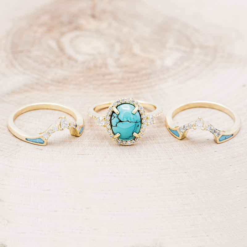 Shown here is "KB", a halo-style oval turquoise women's engagement ring with diamond accents and "Sama" tracers, laying together. Many other center stone options are available upon request.