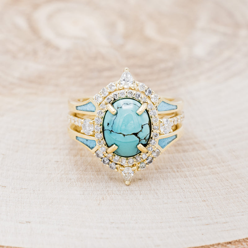 Shown here is "KB", a halo-style oval turquoise women's engagement ring with diamond accents and "Sama" tracers, front facing. Many other center stone options are available upon request.