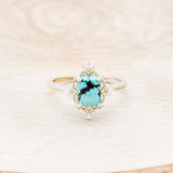 Shown here is "Treva", a turquoise women's engagement ring with diamond accents, front facing. Many other center stone options are available upon request.