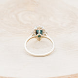 Shown here is "Treva", a turquoise women's engagement ring with diamond accents, back view. Many other center stone options are available upon request.