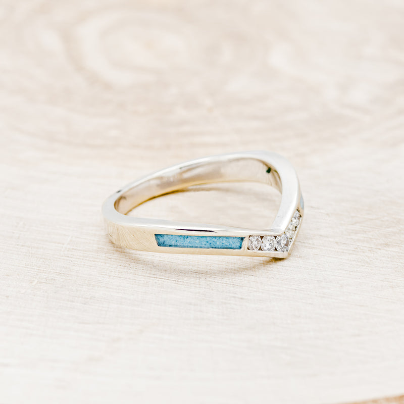 Shown here is "Kida", a custom, handcrafted women's stacking band featuring turquoise inlays and diamonds on a 14K gold band, facing right. Additional inlay options are available upon request.