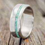 Shown here is "Vertigo", a custom, handcrafted men's wedding ring featuring an inlay with a malachite and opal mixture, upright facing left. Additional inlay options are available upon request.