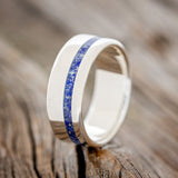 Shown here is "Vertigo", a custom, handcrafted men's wedding ring featuring a beautiful mixture of lapis lazuli & fire and ice opal inlay, upright facing left. Additional inlay options are available upon request.