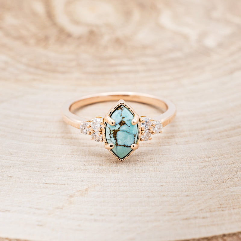 Shown here is "Raya", a turquoise women's engagement ring with diamond accents, front facing. Many other center stone options are available upon request.