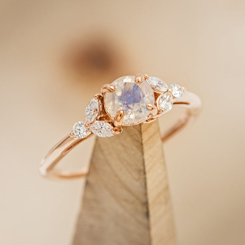 Shown here is "Blossom", an accented-style moonstone women's engagement ring with delicate and ornate details and is available with many center stone options