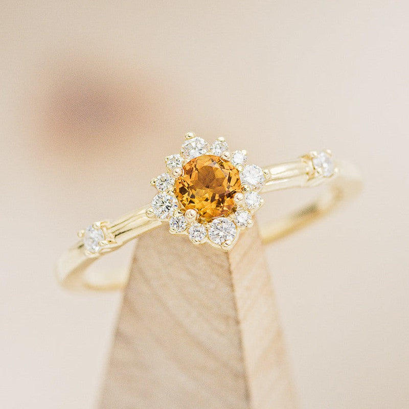 shown here is The "Starla", a round citrine women's engagement ring with diamond accents and is available with many center stone options