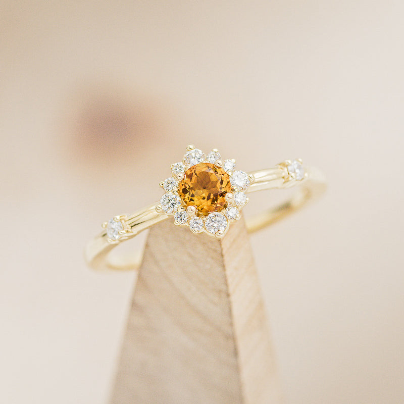 Shown here is The "Starla" , a round citrine women's engagement ring with diamond accents and is available with many center stone options