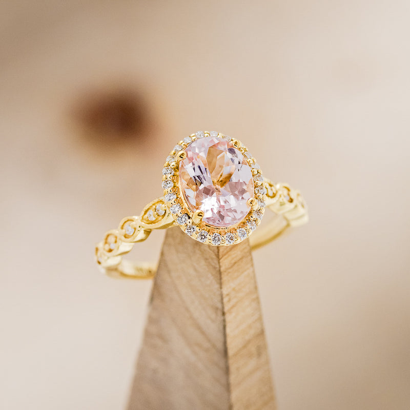 Shown here is an accented-style morganite women's engagement ring, on stand facing slightly right, with delicate and ornate details and is available with many center stone options