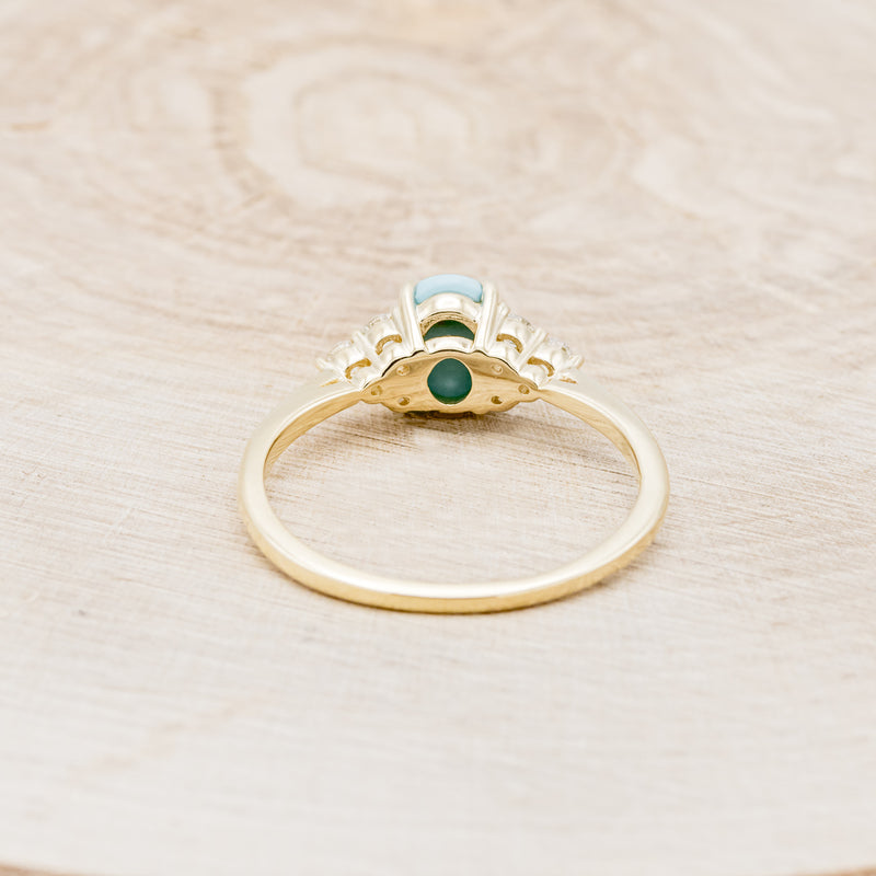 Shown here is "Rhea", a turquoise women's engagement ring with diamond accents, back view. Many other center stone options are available upon request.