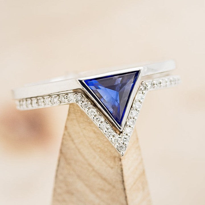 Shown here is The "Jenny From The Block", a dainty-style triangle Chatham sapphire women's engagement ring with delicate and ornate details and is available with many center stone options and inlays-Triangle Sapphire Wedding Band Diamond Stacking V Shape Womens Engagement Ring - Staghead Designs