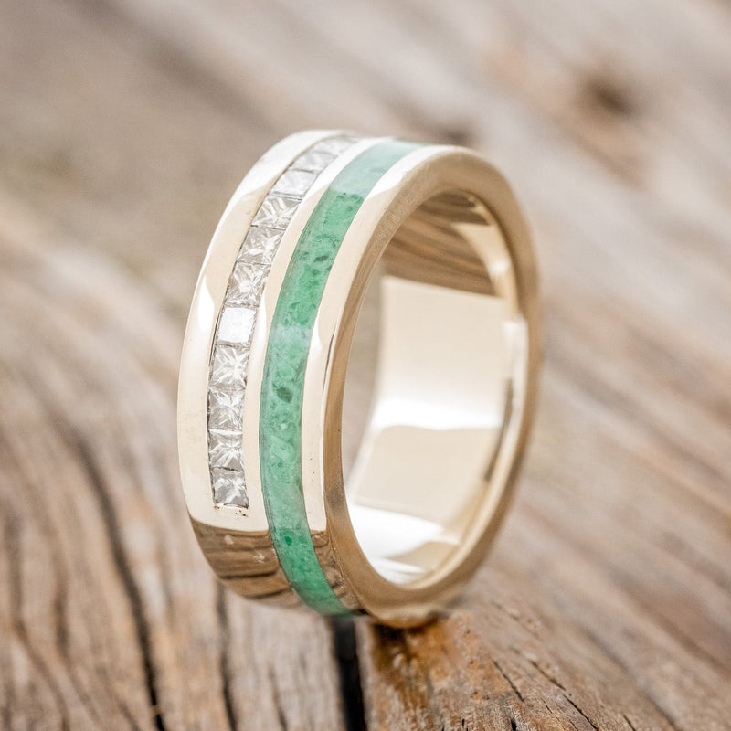 Shown here is "Memphis", a custom, handcrafted men's wedding ring featuring a malachite inlay and princess cut diamond accents, upright facing left. Additional inlay options are available upon request.