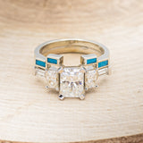 "GRETA" - EMERALD CUT MOISSANITE ENGAGEMENT RING WITH DIAMOND ACCENTS & TURQUOISE TRACER