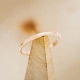 Shown here is a custom, handcrafted woman's stacking band. 