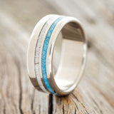 Shown here is "Cosmo", a custom, handcrafted men's wedding ring featuring an elk antler and hand-crushed turquoise offset into two channels, upright facing left. Additional inlay options are available upon request.