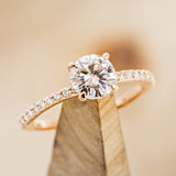 Shown here is a Moissanite Engagement Ring with Diamond Accents - Staghead Designs