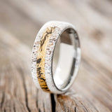 Shown here is "Canyon", a custom, handcrafted men's ring featuring a spalted maple inlay set between two antler overlays, upright facing left. Additional inlay options are available upon request.