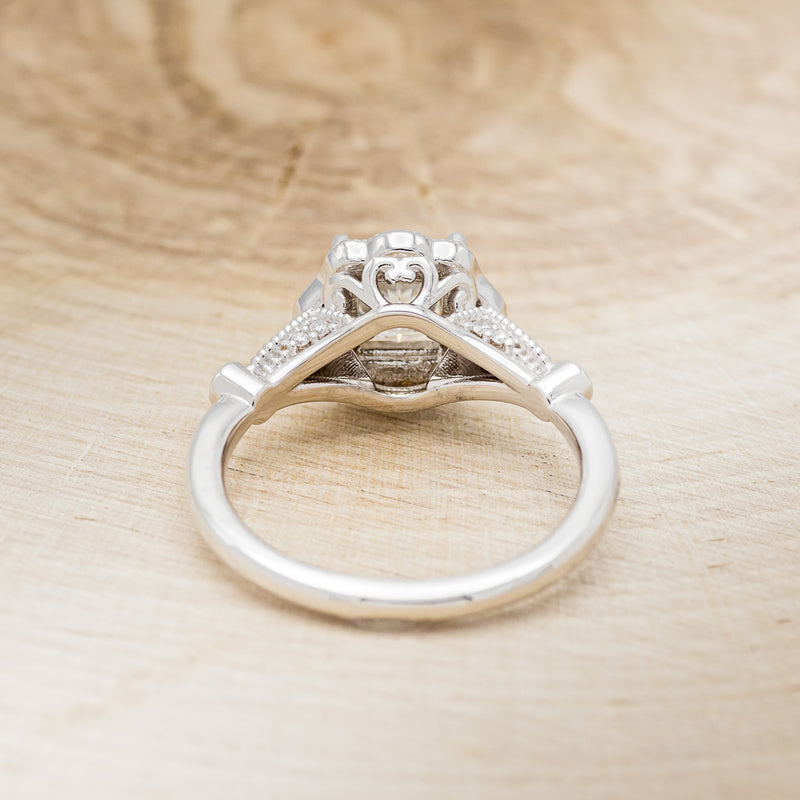 Shown here is "Eileen", a vintage-style moissanite women's engagement ring with black diamond accents, back view. Many other center stone options are available upon request.