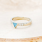 Shown here is a custom, handcrafted women's stacking band featuring a triangle channel with hand-crushed turquoise and 2 diamonds on each side of the triangle, facing left. Additional inlay options are available upon request.