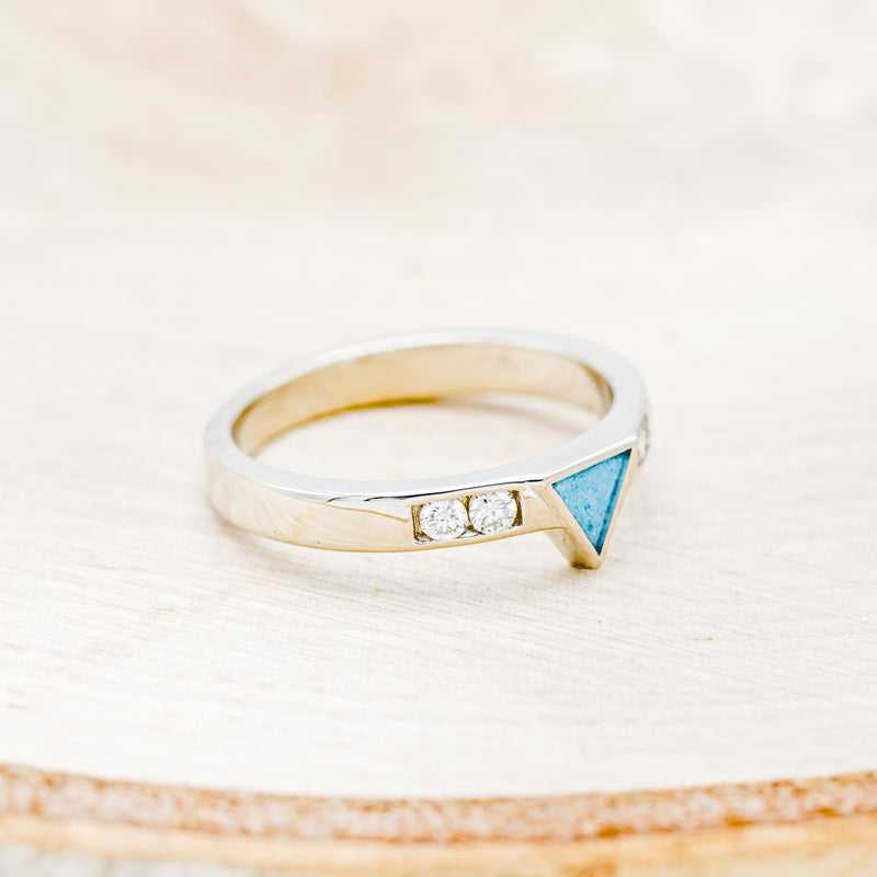 Shown here is a custom, handcrafted women's stacking band featuring a triangle channel with hand-crushed turquoise and 2 diamonds on each side of the triangle, facing right. Additional inlay options are available upon request.