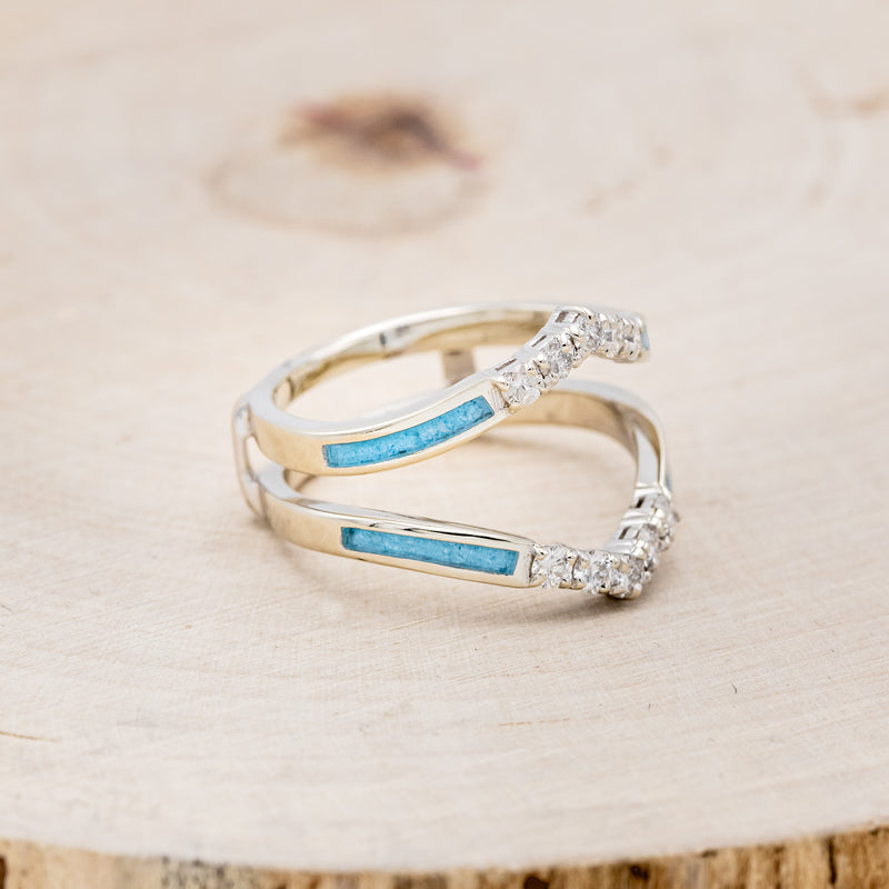 Shown here is "Raya", ring guard, a custom, handcrafted ring featuring turquoise inlays and diamond accents, facing right.