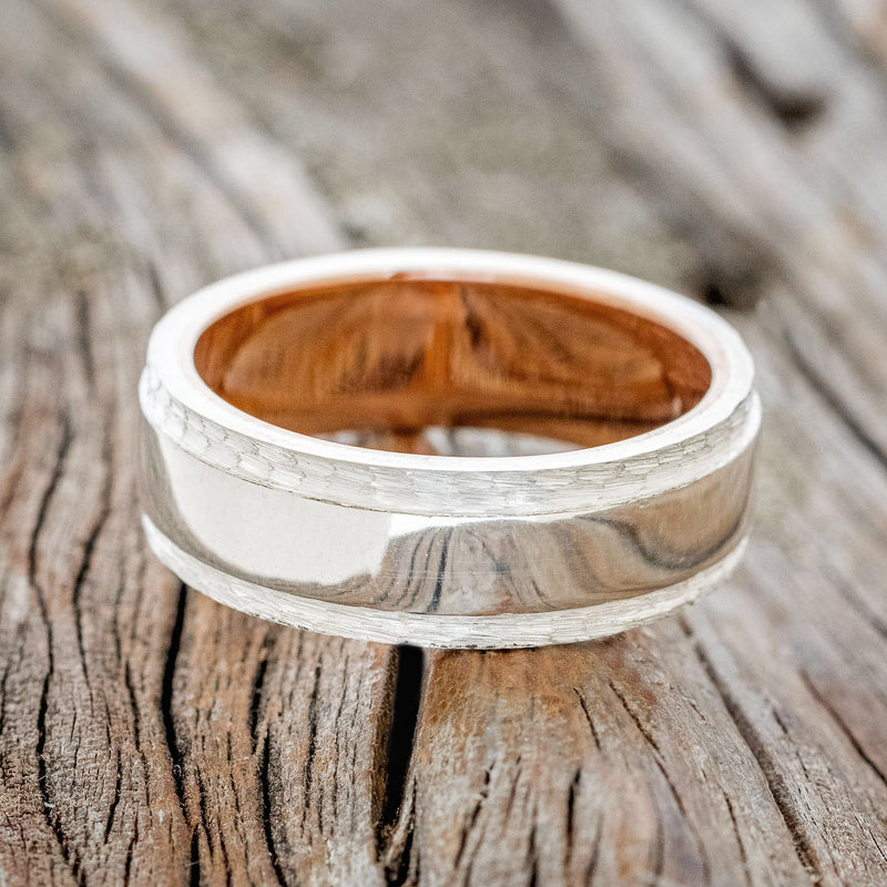 "SEDONA" - RAISED CENTER & HAMMERED EDGES WEDDING RING FEATURING A 14K GOLD LINED BAND