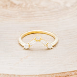 Shown here is "Melody", a 14K gold v-shaped tracer with 1/4 CTW diamonds, front facing.