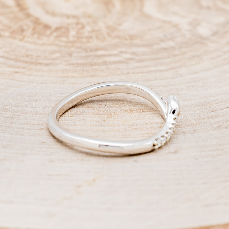 Shown here is "Serpent", a snake-style wedding band featuring diamond accents, facing right.