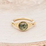 Shown here is "Selene", an accented-style moss agate women's engagement ring, front facing. Many other center stone options are available upon request.